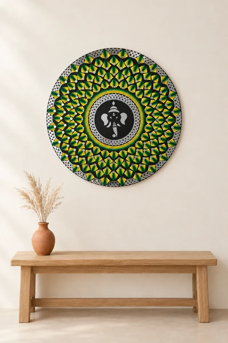 Gajanana in Green hanging on a plain wall above a wooden bench